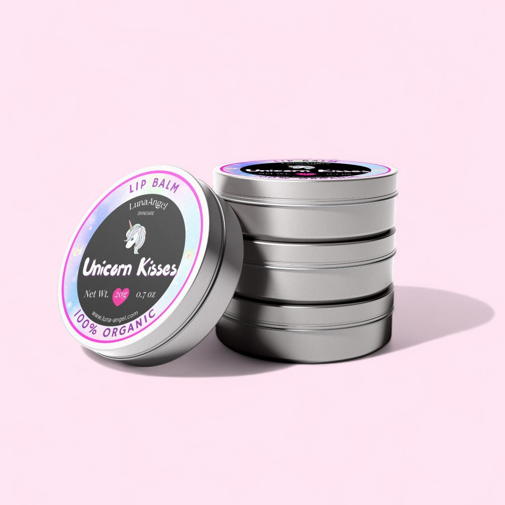 Luna & Lily Unicorn Kisses lip balm tins on a pink background