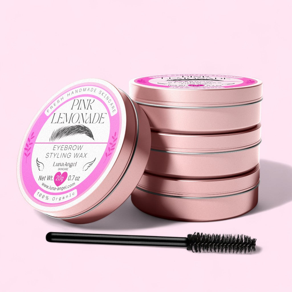 Eyebrow styling wax with pink lemonade flavor, surrounded by stacked tins on a light pink background.