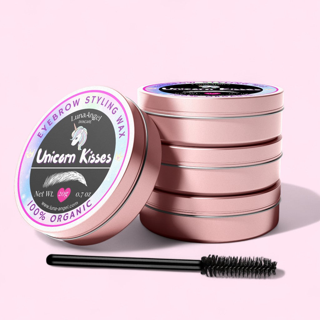 Eyebrow styling wax with a brush on a pink background