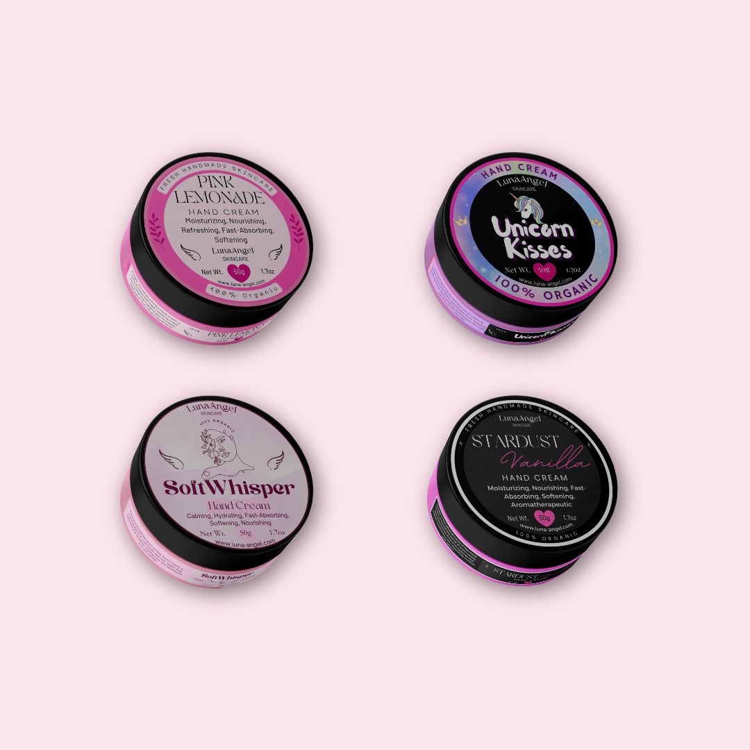 LunaAngel Hand Cream Collection featuring Pink Lemonade, Soft Whisper, Unicorn Kisses, and Stardust Vanilla hand creams on a soft pink background