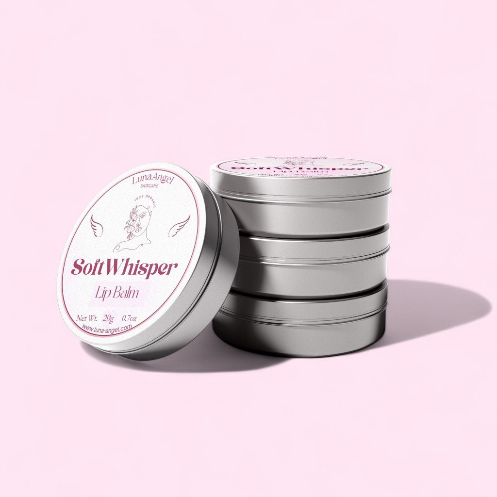 Stack of 'Soft Whisper' lip balm tins on a pink background