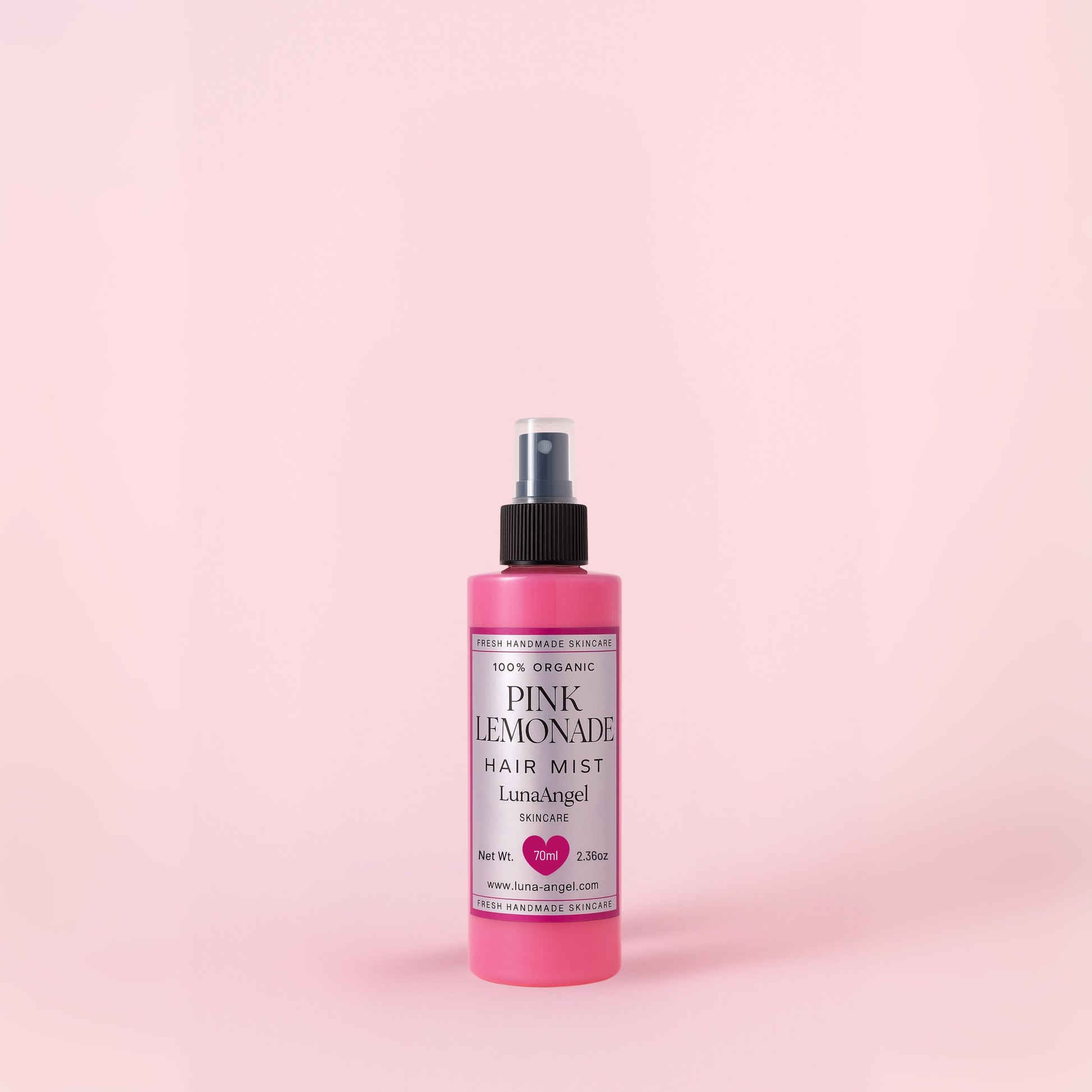 Pink Lemonade hair mist bottle with pink summer design
