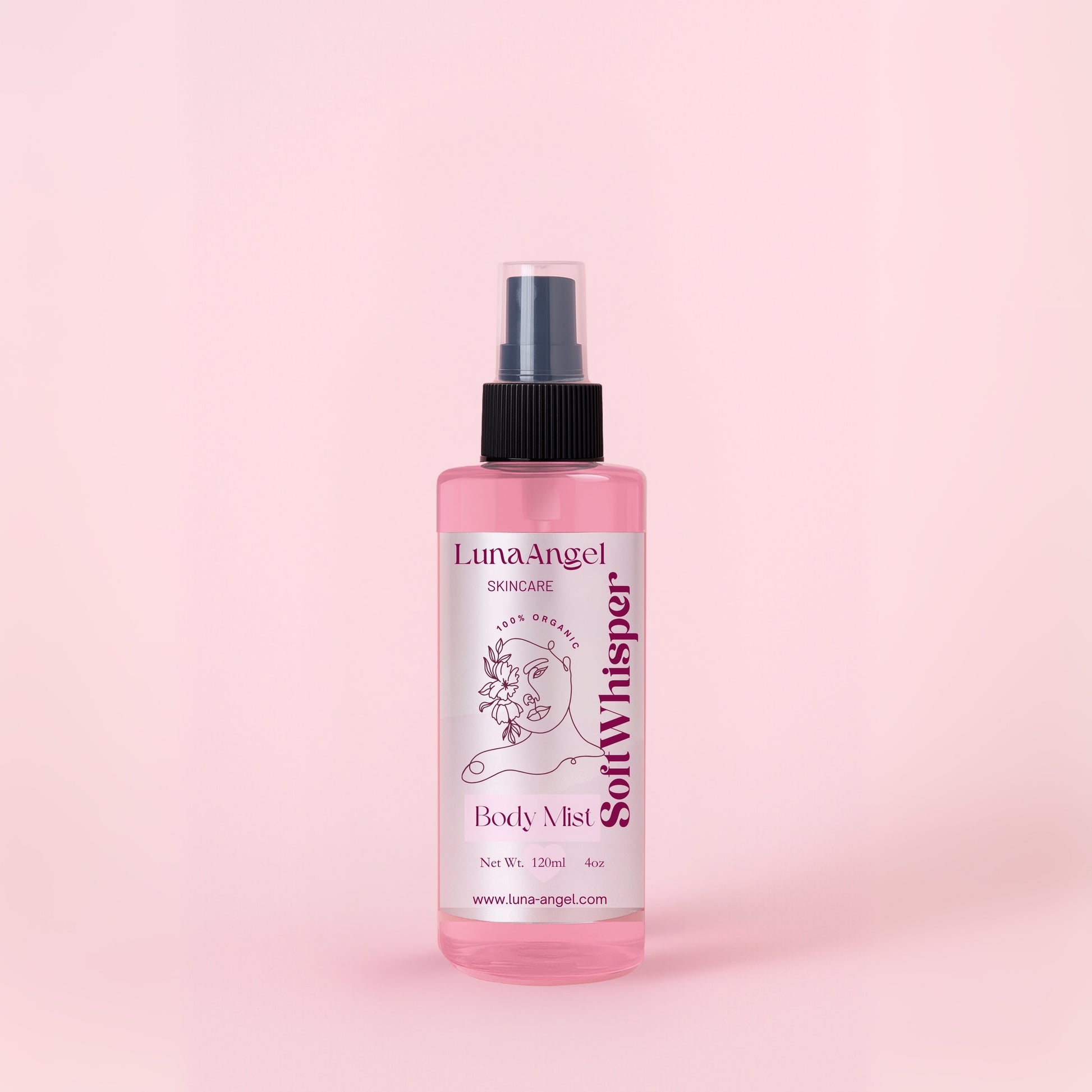 Soft Whisper body mist bottle on soft pink background