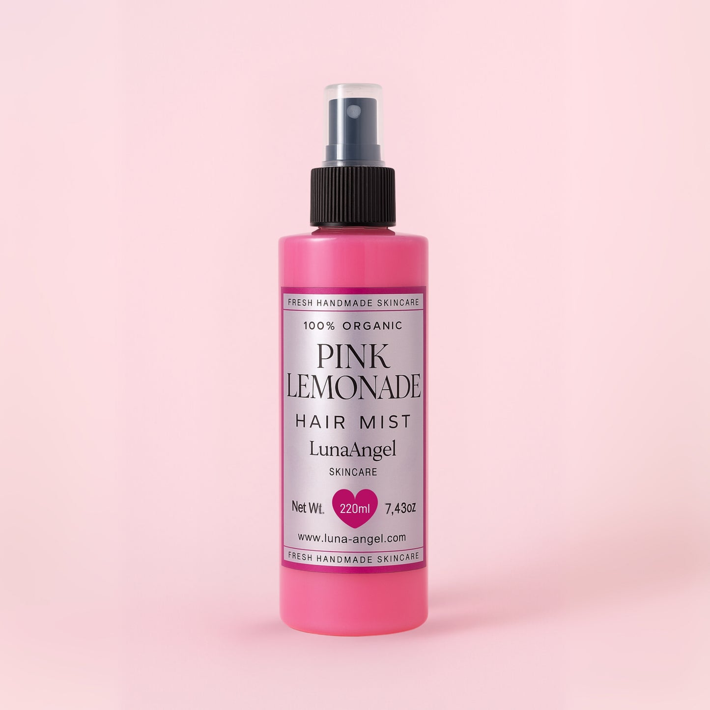 Pink Lemonade hair mist bottle on a pink background