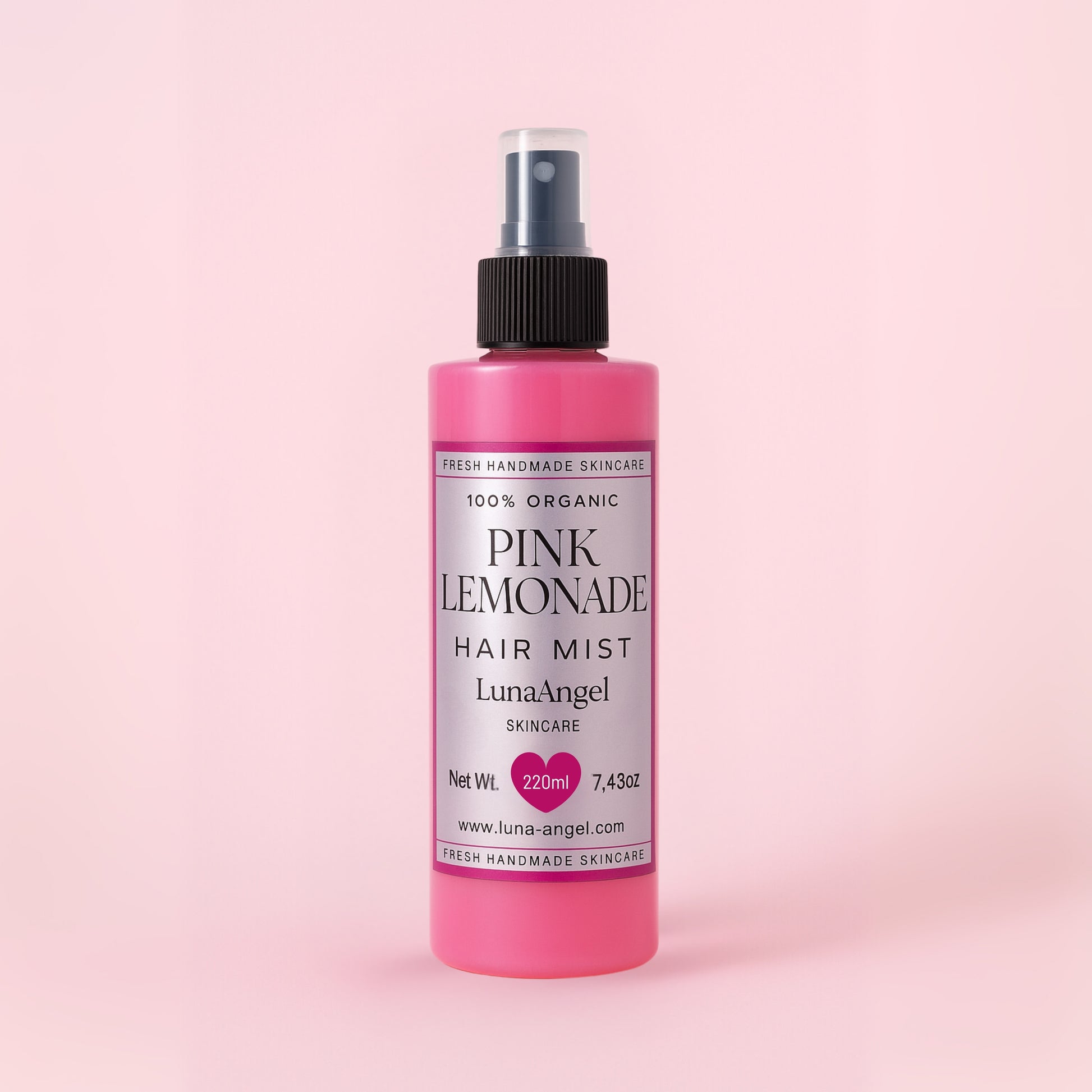 Pink Lemonade hair mist bottle on a pink background