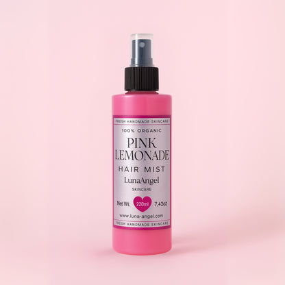 Pink Lemonade hair mist bottle on a pink background