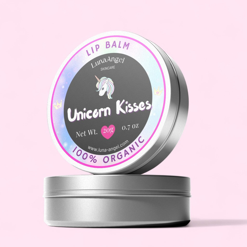 Lip balm container labeled 'Unicorn Kisses' with a pink background