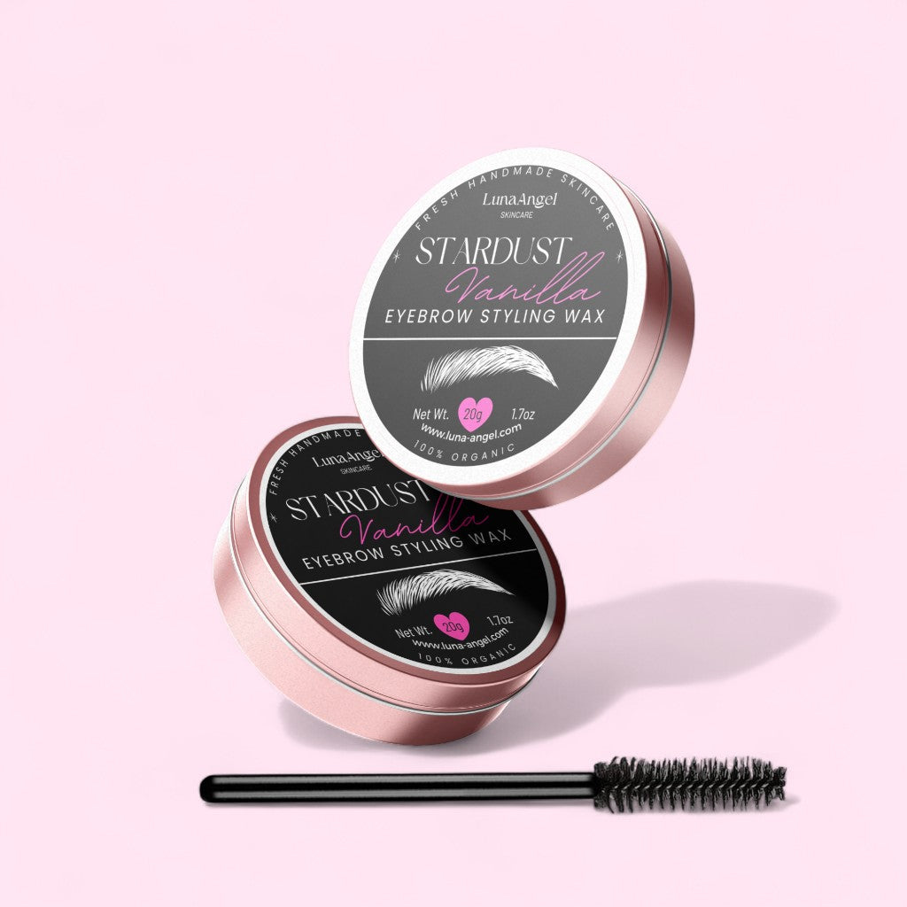 LunaAngel Stardust Vanilla eyebrow styling wax tins with applicator brush on a light pink background – organic 20g skincare product