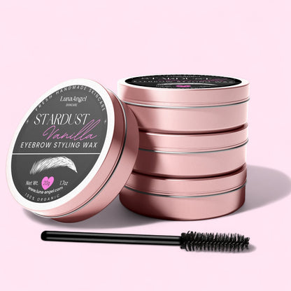 LunaAngel Stardust Vanilla eyebrow styling wax tins stacked with applicator brush on a light pink background – organic 20g product