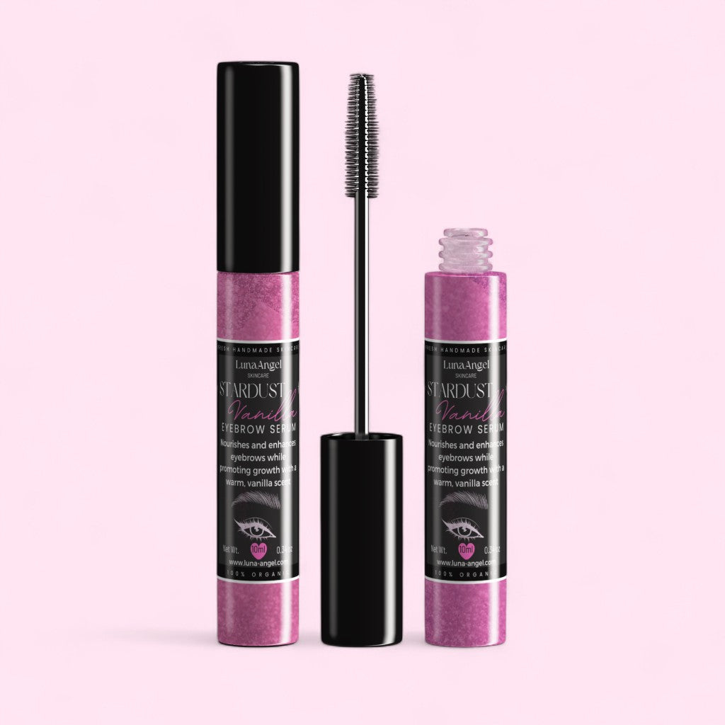 Eyebrow serum with applicator on a pink background